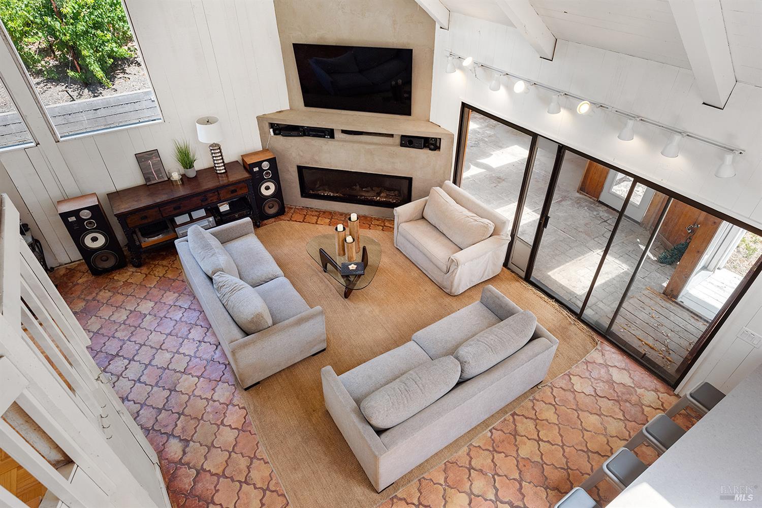 995 Dry Creek Road Healdsburg, CA 95448 - Photo 35 of 57 a living room with furniture and a flat screen tv