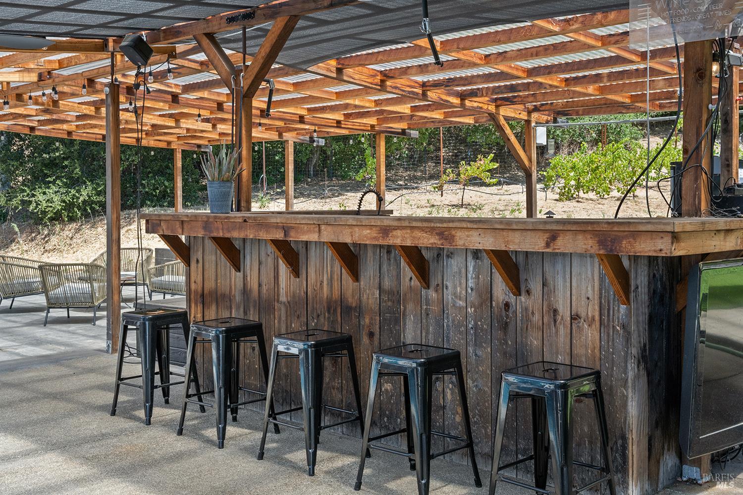 995 Dry Creek Road Healdsburg, CA 95448 - Photo 45 of 57 a porch with a table and chairs in it