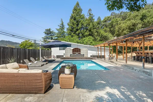 a outdoor space with patio the couches and a dining table with the ocean view