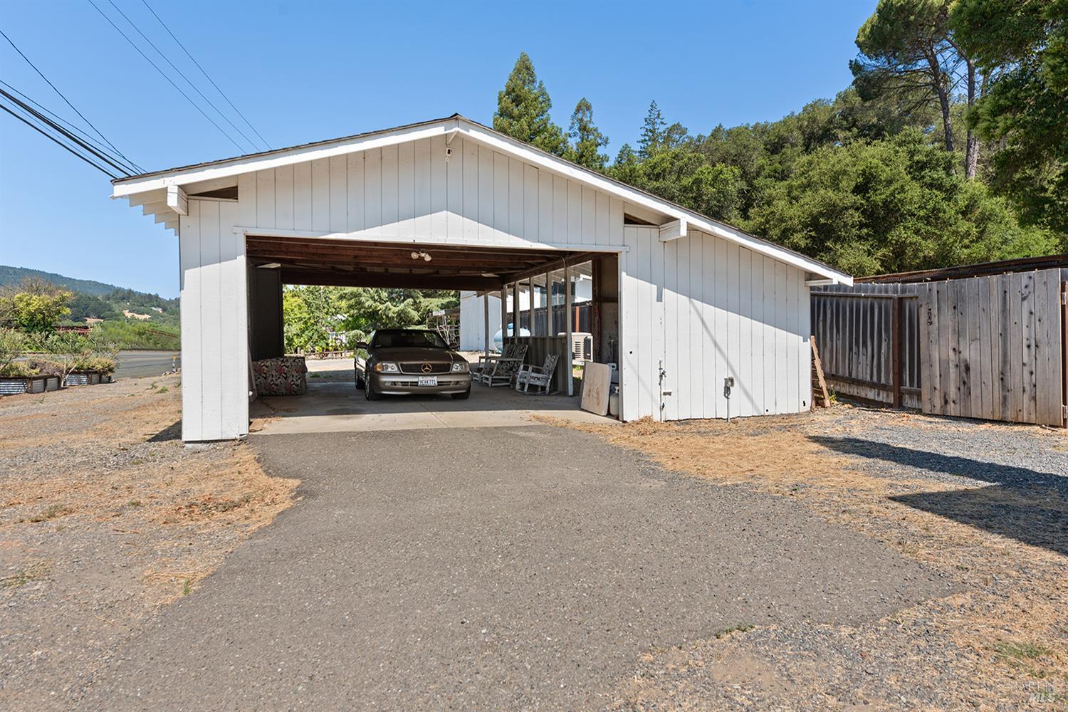 995 Dry Creek Road Healdsburg, CA 95448 - Photo 53 of 57 a view of a house with a garage and yard
