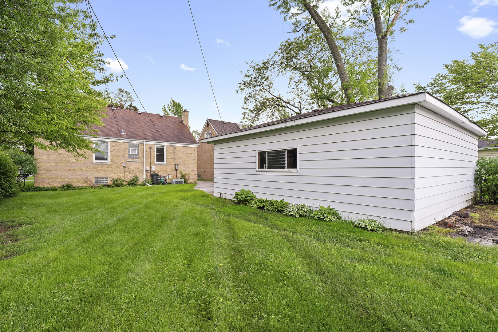2252 2nd Avenue North Riverside, IL 60546 - Photo 16 of 16 a view of a backyard with plants and large tree