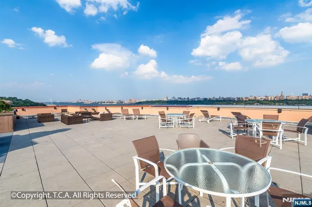 a close up view of a washer and dryer in a small bathroom