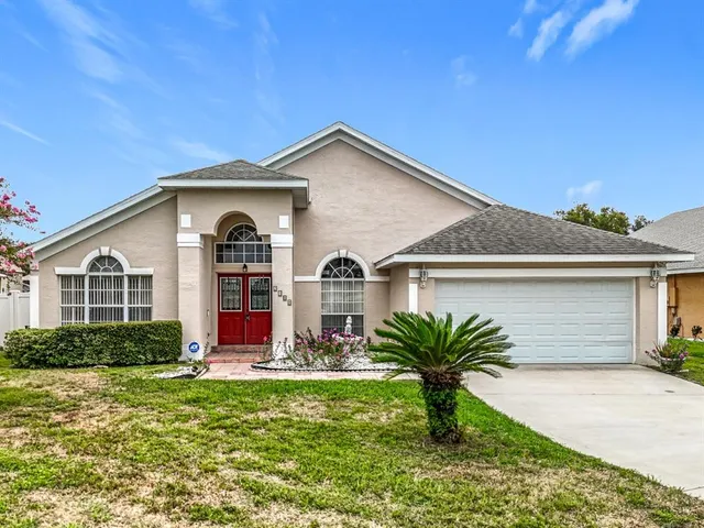 a front view of house with yard and green space