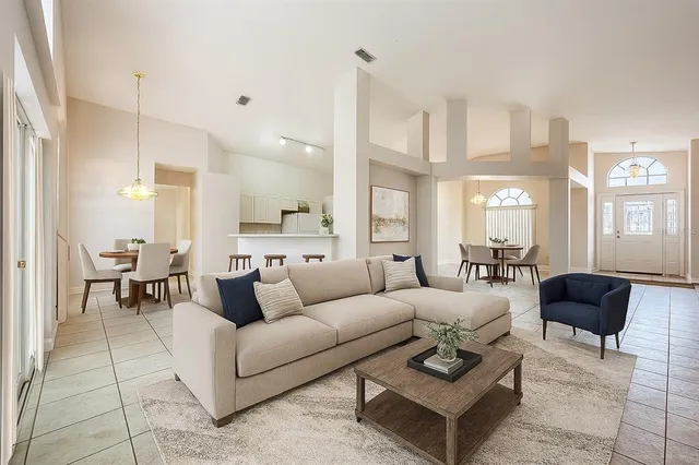 a kitchen with a refrigerator sink and cabinets