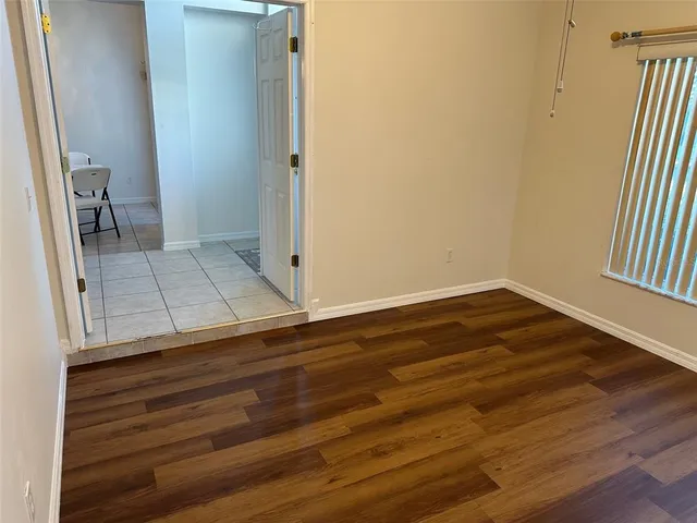 a room with gym equipment and windows