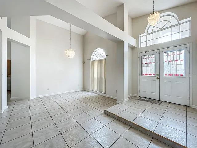 a view of an entryway with a chandelier