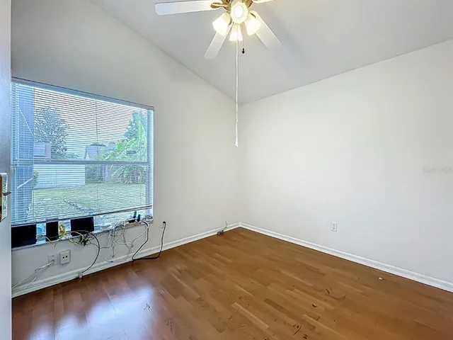 a bathroom with a granite countertop sink a toilet and a bathtub