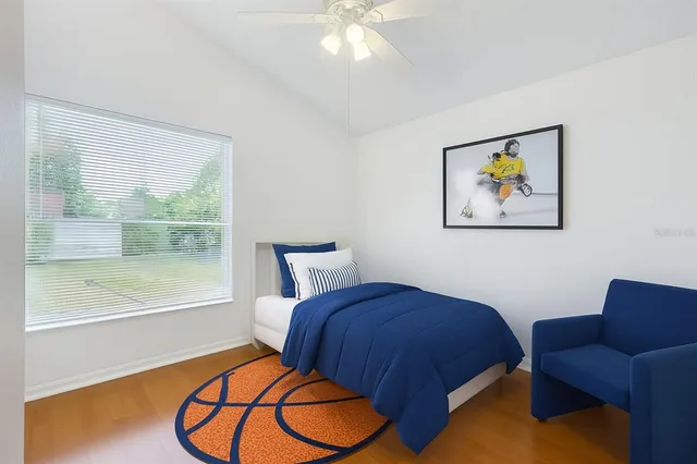 a bathroom with a granite countertop sink a toilet a mirror and shower