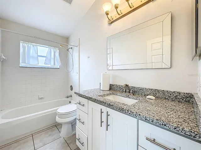 a view of a backyard with swimming pool