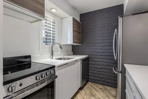 a view of kitchen with a sink