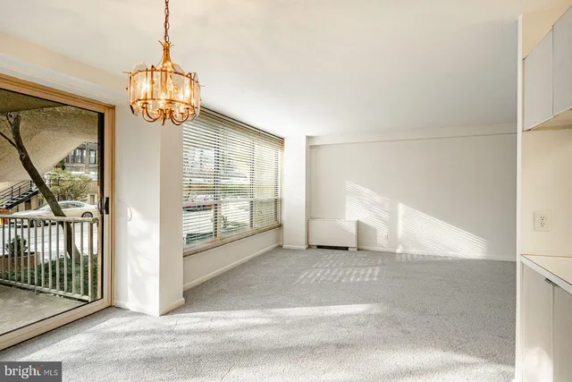 a view of entrance and hall with chandelier