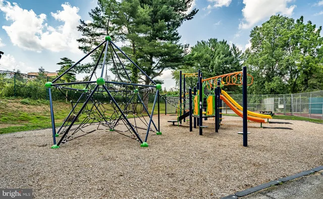 a view of a backyard with swings