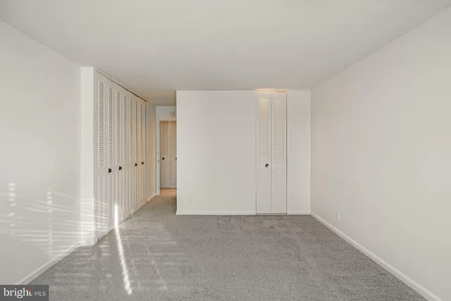 a view of kitchen with wooden floor and electronic appliances