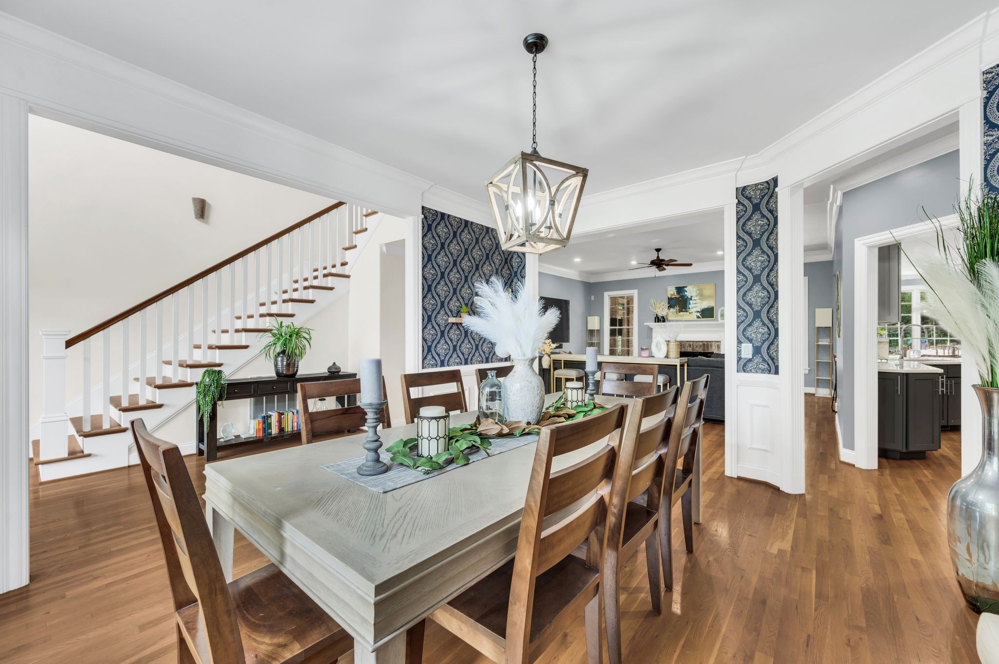 149 Allenhurst Circle Franklin, TN 37067 - Photo 12 of 66 a view of a dining room and livingroom with furniture wooden floor a chandelier
