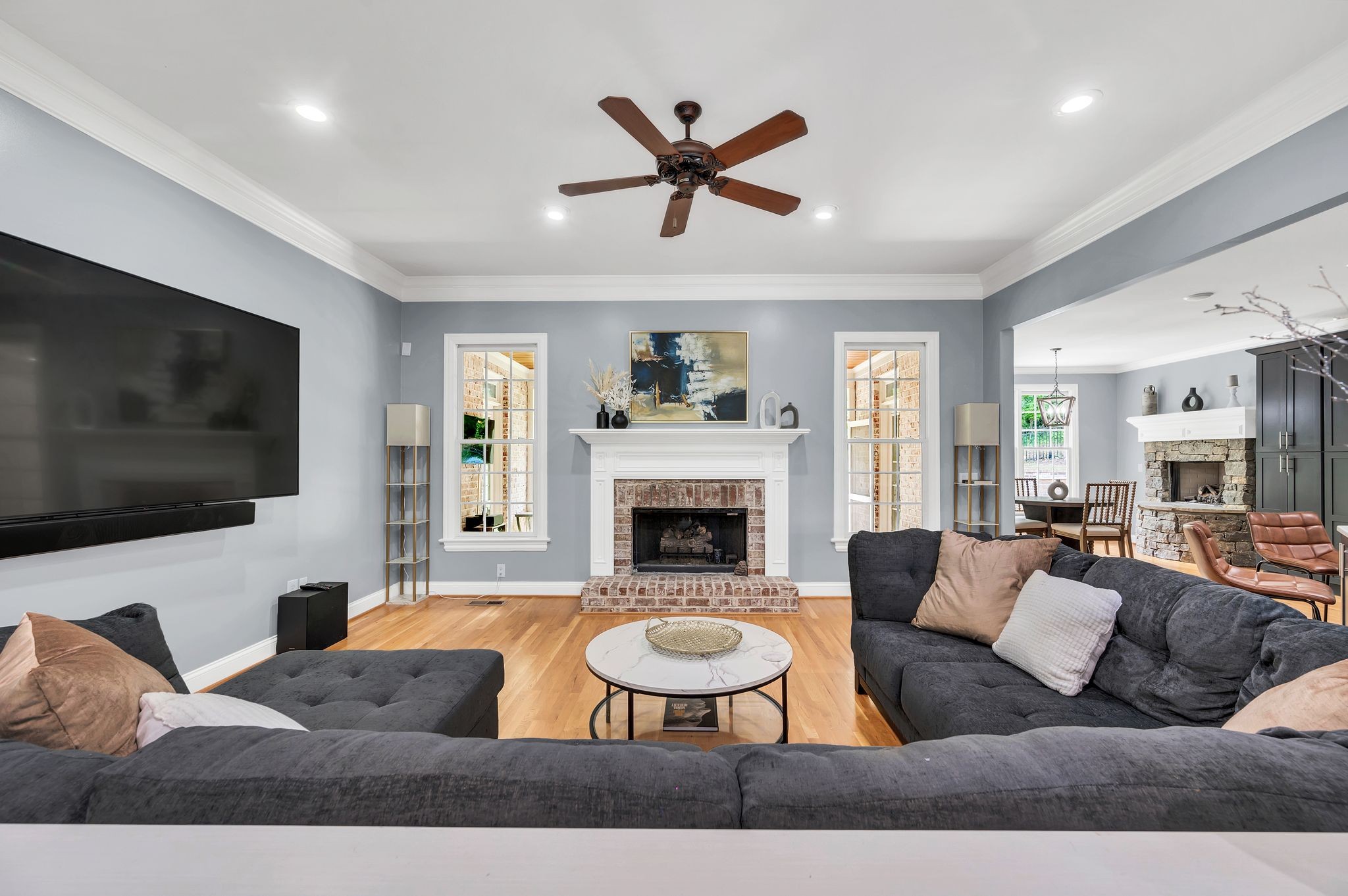 149 Allenhurst Circle Franklin, TN 37067 - Photo 17 of 66 a living room with furniture a fireplace and a flat screen tv