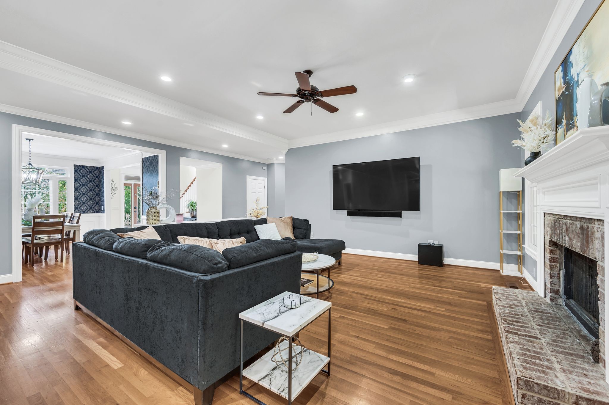 149 Allenhurst Circle Franklin, TN 37067 - Photo 19 of 66 a living room with furniture a flat screen tv and a fireplace