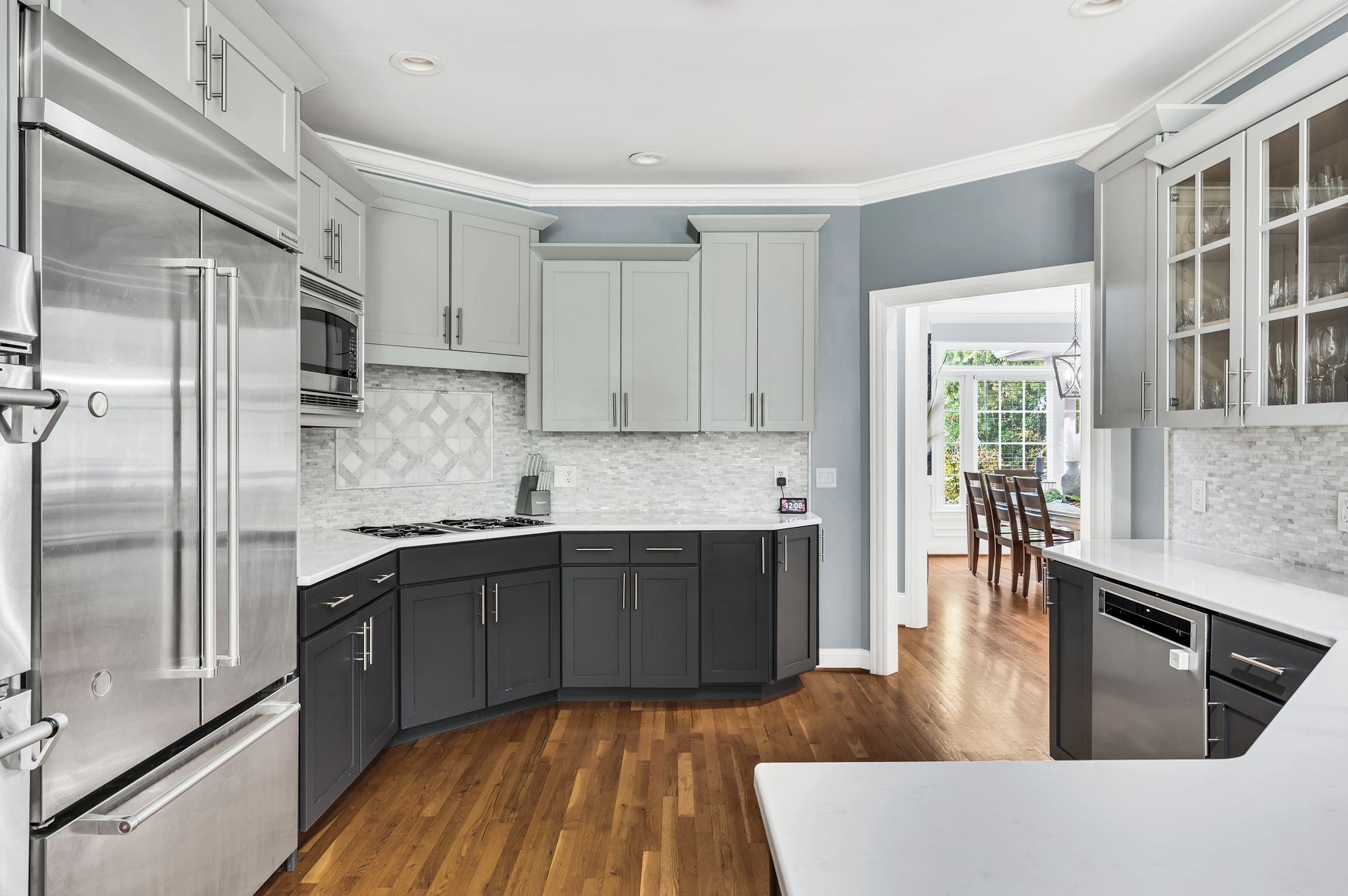 149 Allenhurst Circle Franklin, TN 37067 - Photo 22 of 66 a kitchen with stainless steel appliances granite countertop a refrigerator a sink dishwasher a stove and white countertops with wooden floor