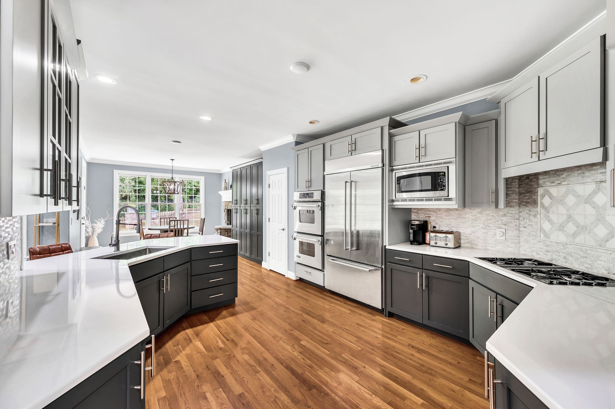 149 Allenhurst Circle Franklin, TN 37067 - Photo 26 of 66 a large kitchen with stainless steel appliances granite countertop a stove refrigerator and cabinets