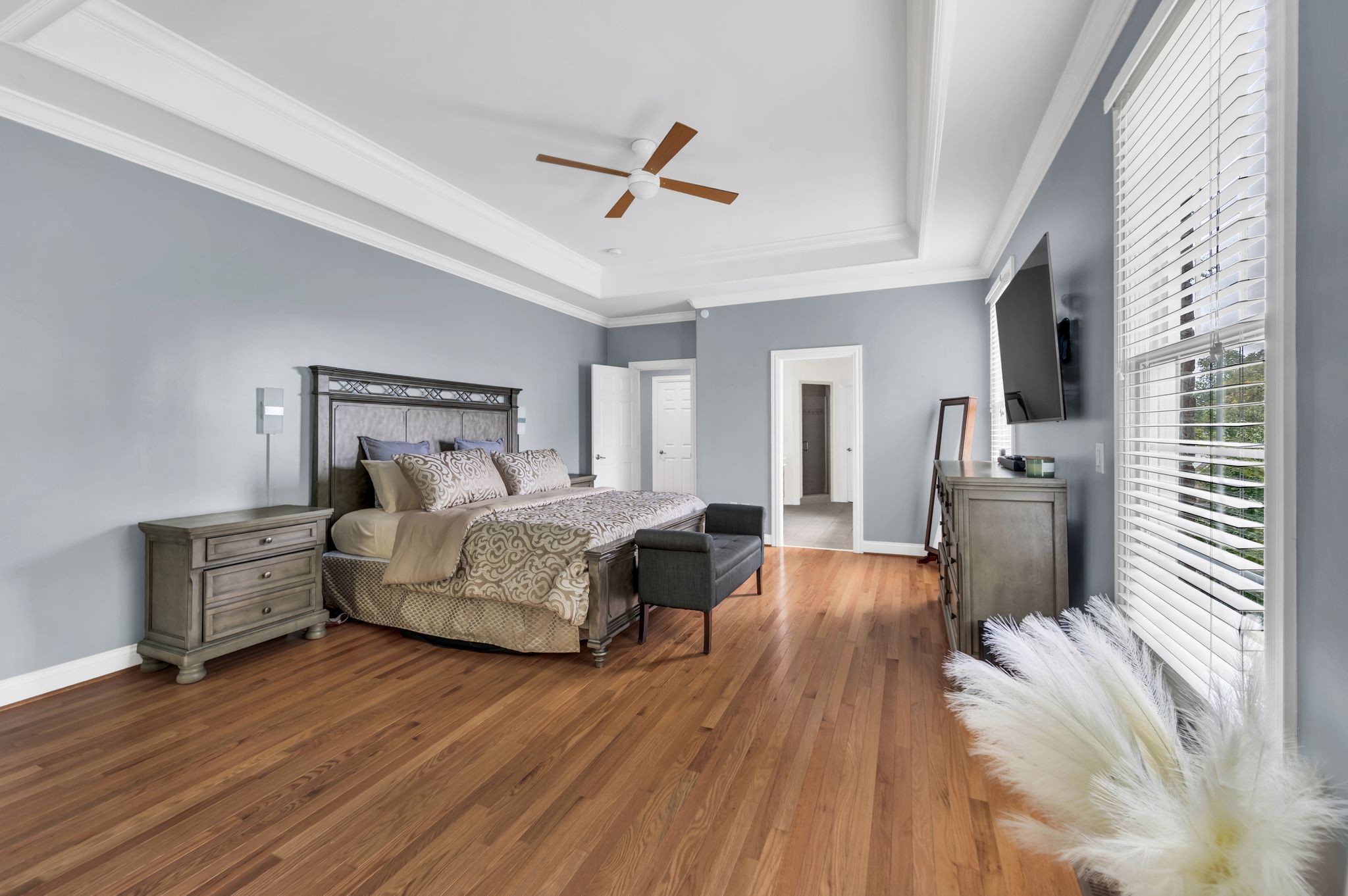 149 Allenhurst Circle Franklin, TN 37067 - Photo 33 of 66 a bedroom with a bed and wooden floor