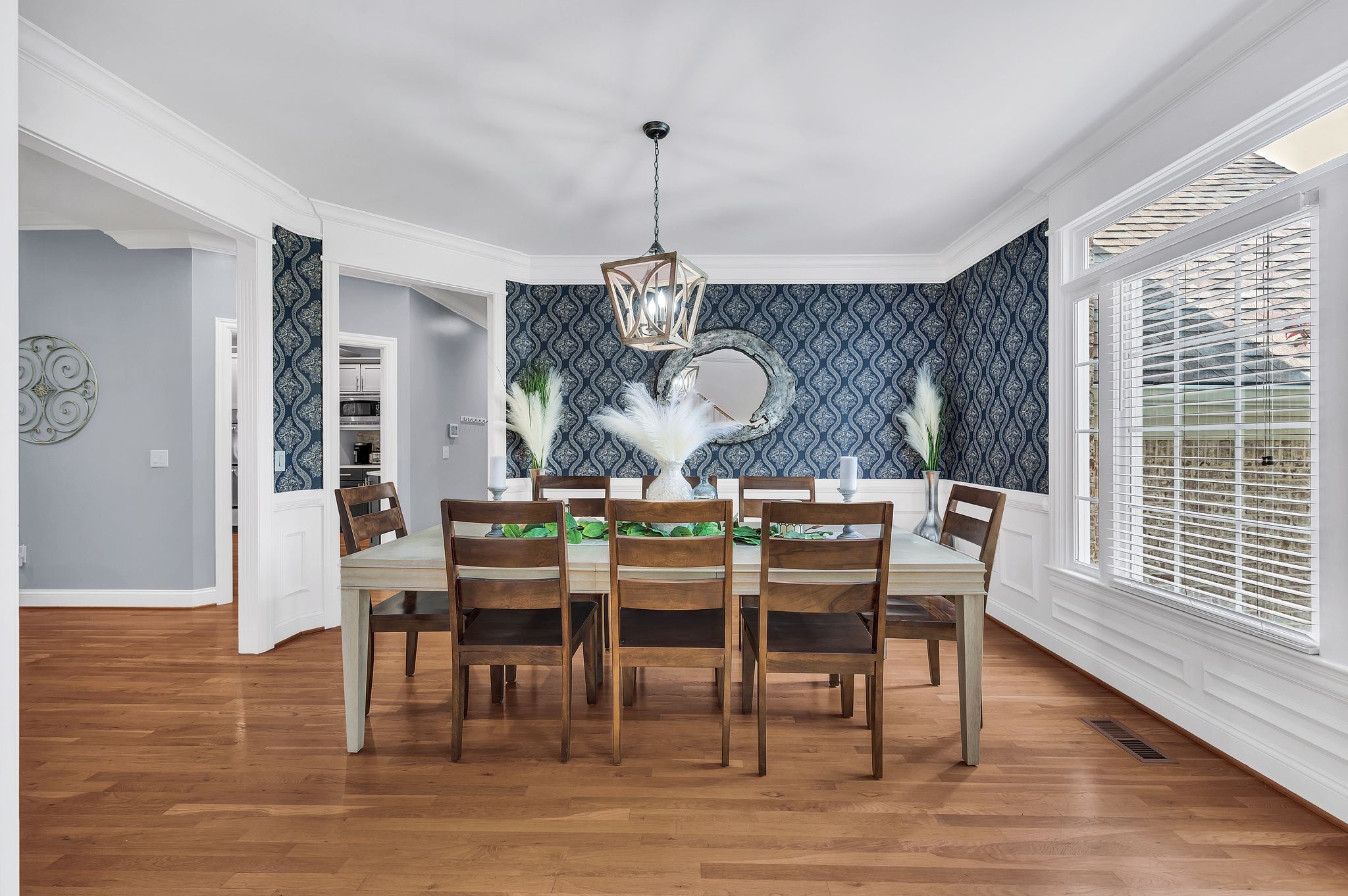 149 Allenhurst Circle Franklin, TN 37067 - Photo 10 of 66 a dining room with wooden floor a chandelier a wooden table and chairs