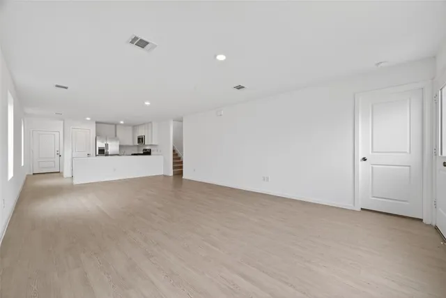 a view of a kitchen with a sink and cabinets