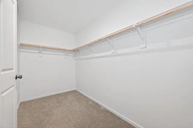 a view of an empty walk in closet