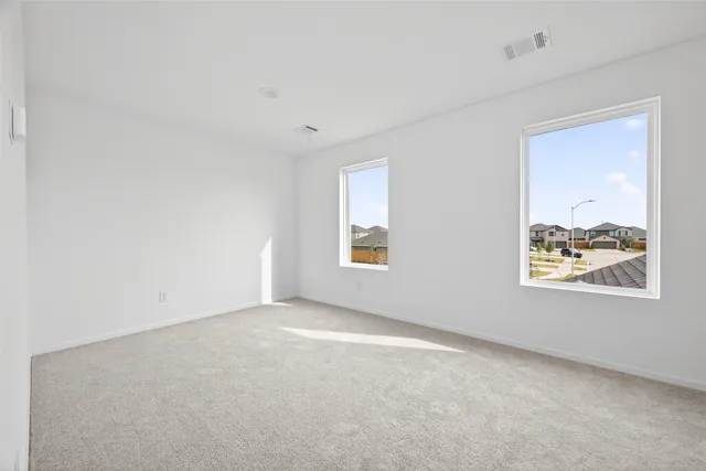 an empty room with windows