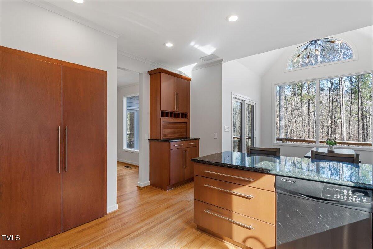 5920 Orchid Valley Road Raleigh, NC 27613 - Photo 24 of 54 Pantry and rear view of nature from kitchen into breakfast nook