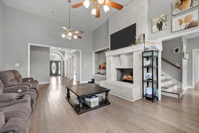 a living room with furniture and a fireplace