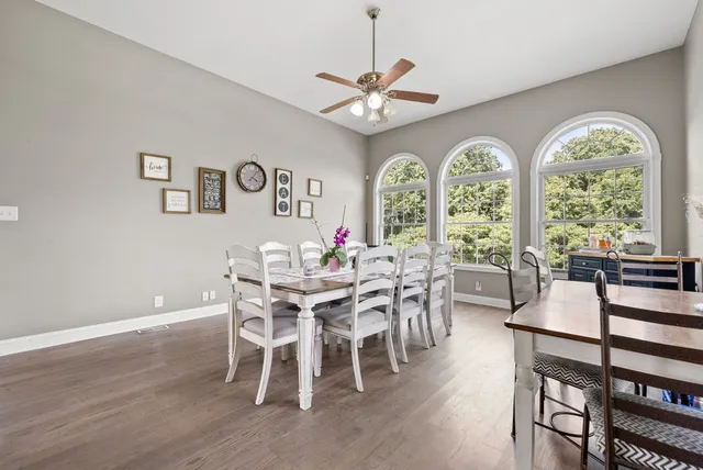 a view of a dining room with furniture window and wooden floor