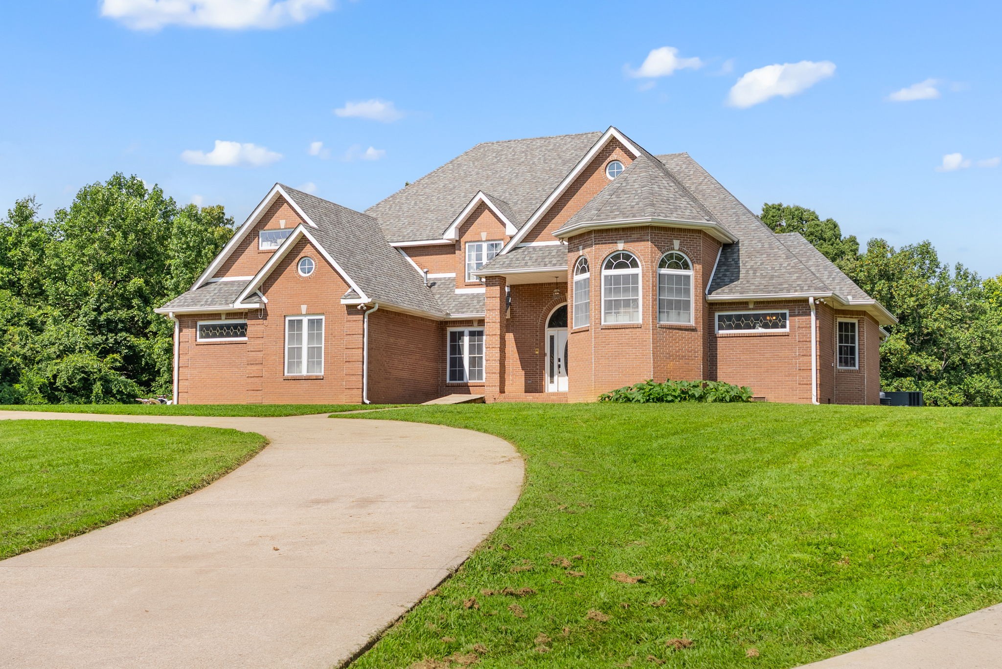 3723 Reed Road Indian Mound, TN 37079 - Photo 2 of 47 a front view of a house with a yard and garage