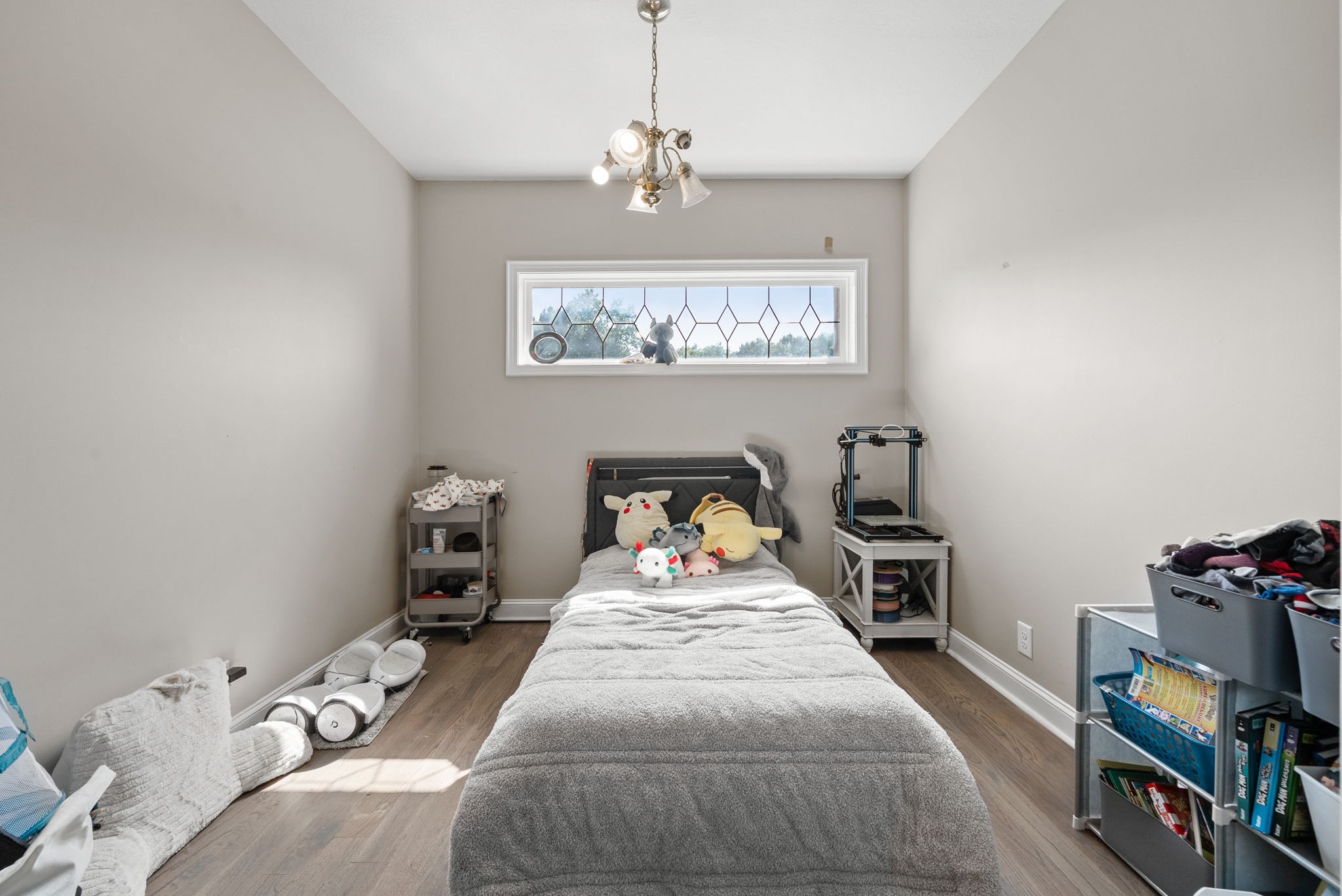 3723 Reed Road Indian Mound, TN 37079 - Photo 23 of 47 a bedroom with a bed and a chandelier