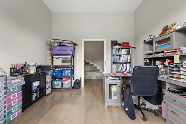a view of a workspace with furniture and toys