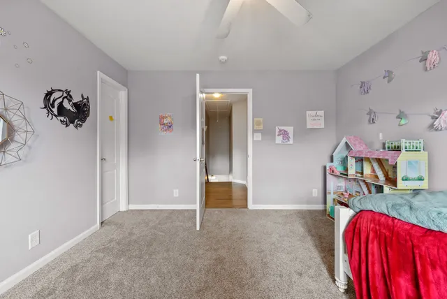 a view of a bedroom with a bed and toys