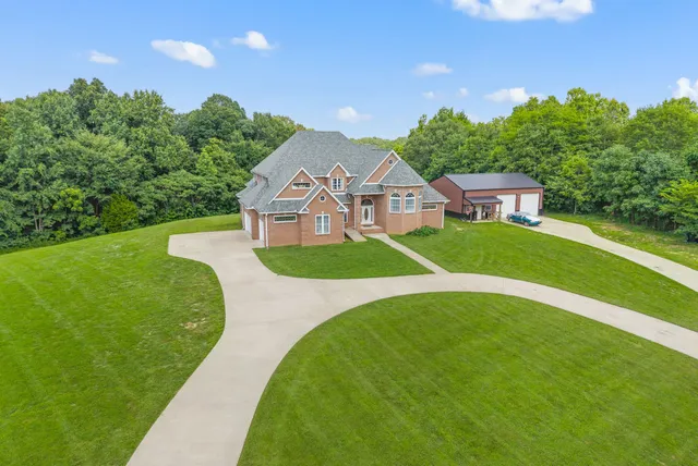 a view of a house with a big yard