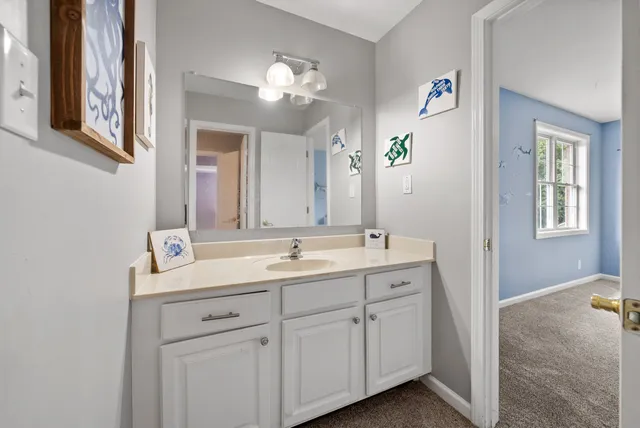 a bathroom with a double vanity sink and a mirror