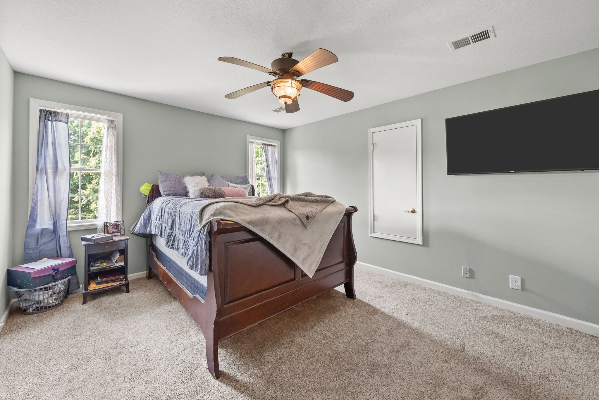 3723 Reed Road Indian Mound, TN 37079 - Photo 35 of 47 a spacious bedroom with a bed and a chandelier
