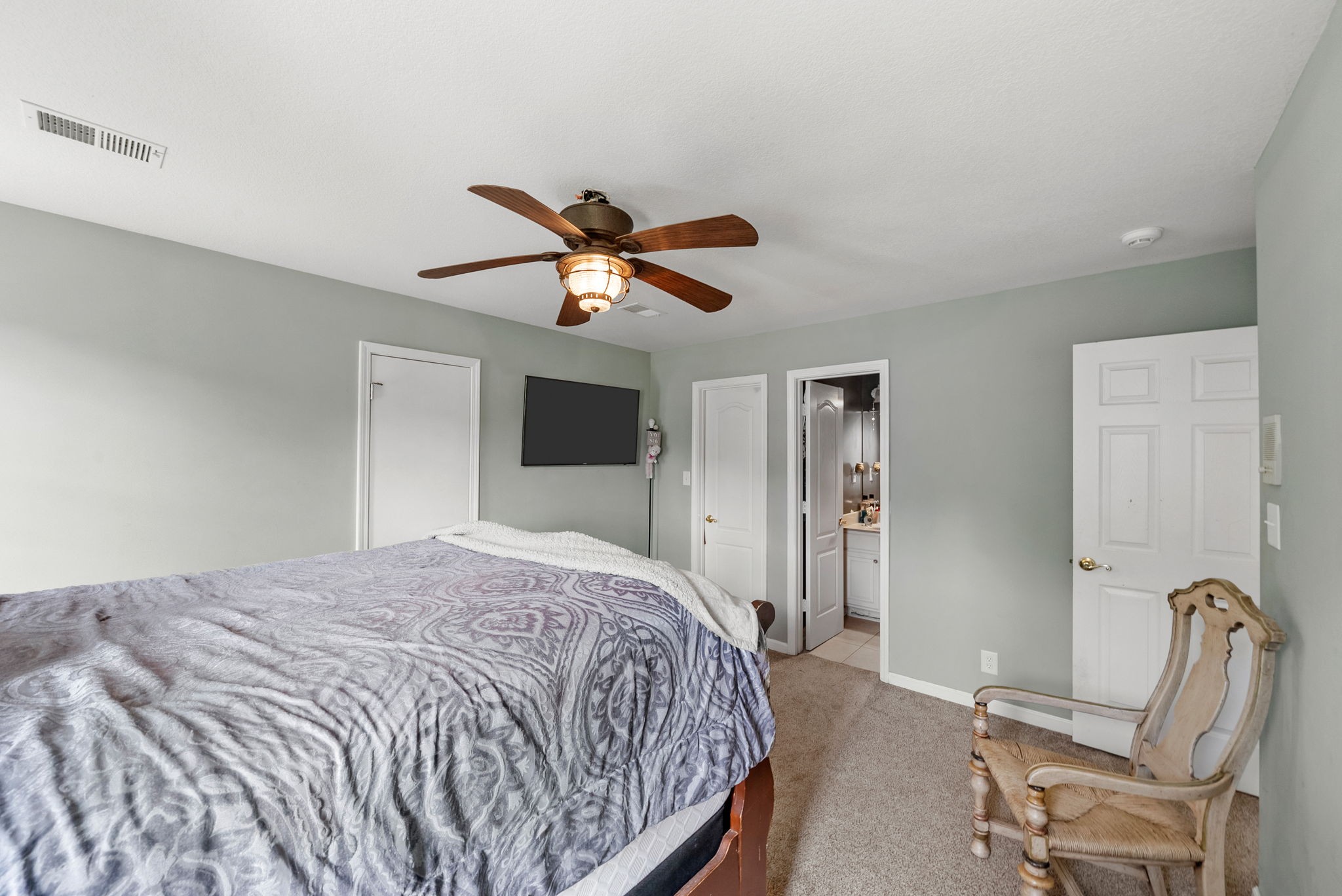 3723 Reed Road Indian Mound, TN 37079 - Photo 36 of 47 a bedroom with a bed and a chandelier