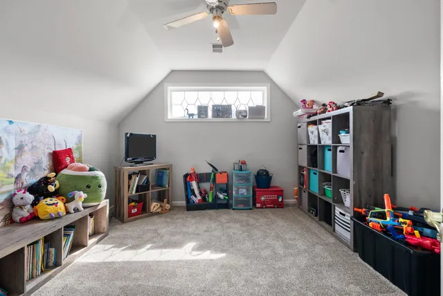 a children room with toys and a flat screen tv