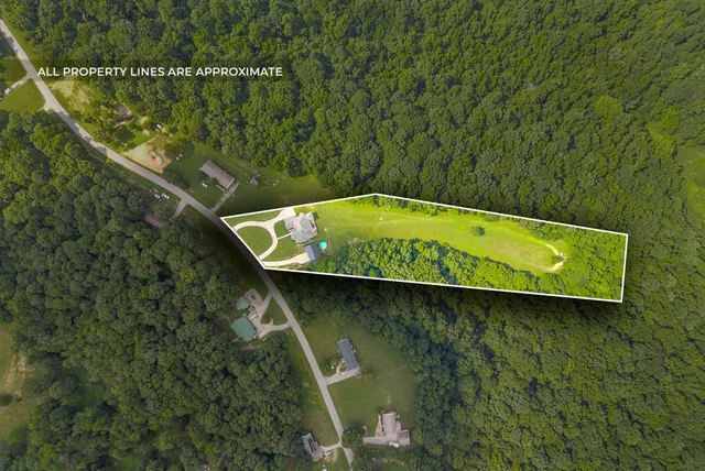 a blue swimming pool with a lake view