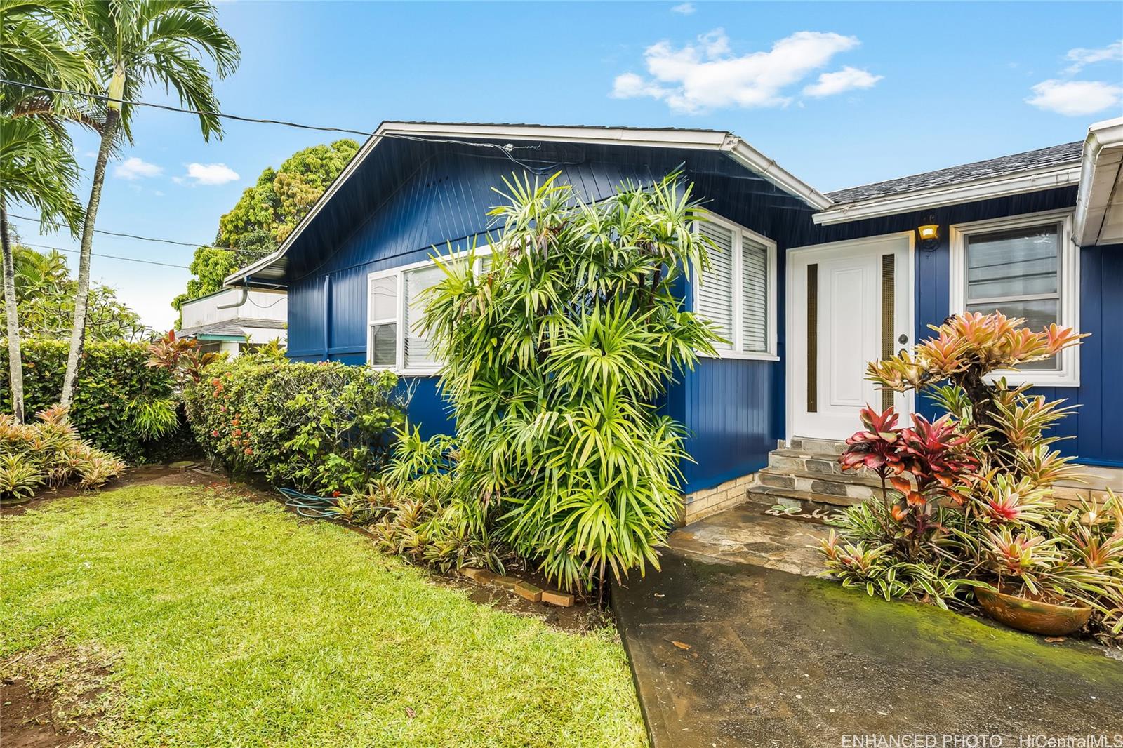 45-458 Pua Inia Street Kaneohe, HI 96744 - Photo 1 of 1 a front view of a house with a yard