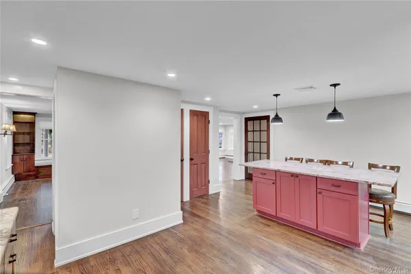 a view of kitchen with wooden floor