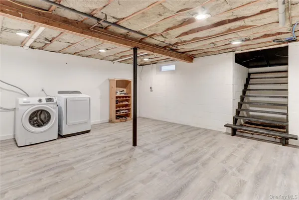 a view of a storage & utility room with washer and dryer