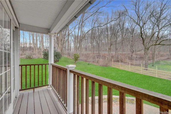a view of a deck with a backyard