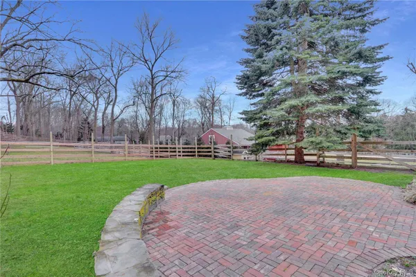 a view of outdoor space with garden and trees