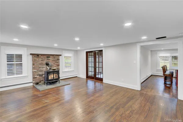 a view of a livingroom with furniture and a flat screen tv