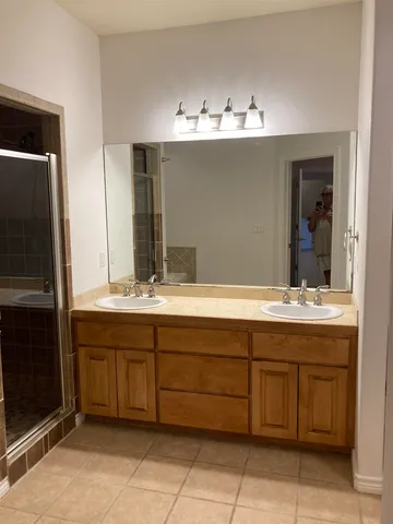 a bathroom with a sink and mirror