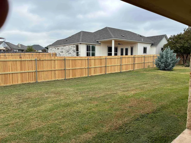 a view of a back yard of the house