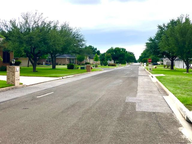 a view of a garden and basketball court
