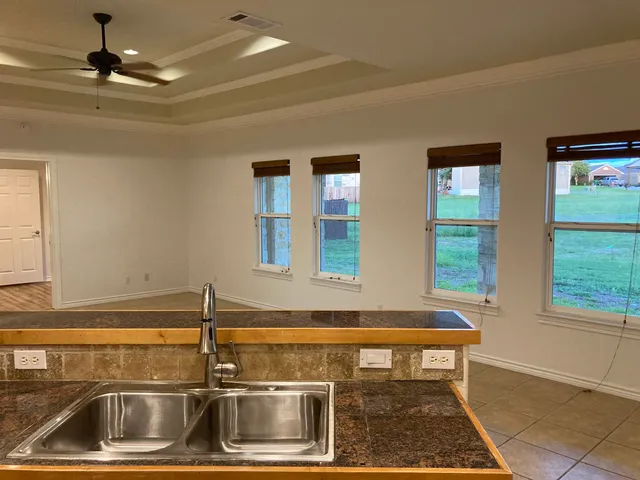 a kitchen with a sink and a window